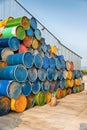 Colorful old industrial metal barrels stacked Royalty Free Stock Photo