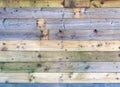 Colorful old rustic wooden plank wall or floor with some of the boards stained blue made of patched reused timber Royalty Free Stock Photo