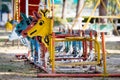 Colorful old and rusty iron rocking horse Royalty Free Stock Photo