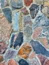 Colorful old stone wall texture background. Background of stone wall of boulders and pebbles. Stone in the beside of house. Black Royalty Free Stock Photo