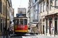 Colorful old tram acrossing colors building