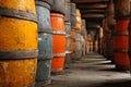 Colorful old wooden barrels aging in a cellar, creating a repetitive pattern Royalty Free Stock Photo