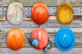 Colorful old and worn construction helmets Royalty Free Stock Photo