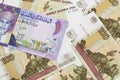 A colorful Omani riyal bank note on one dollar bills Royalty Free Stock Photo