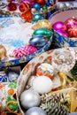 Colorful open round boxes with all sorts of bright Christmas decorations. Royalty Free Stock Photo