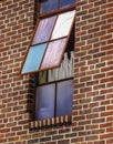 Colorful open window on brick wall Royalty Free Stock Photo