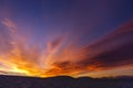 Colorful orange and blue dramatic sky with clouds.