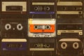 Colorful orange compact cassette in front of black audio tapes