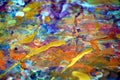 Colorful orange yellow purple gold paint splashes, colorful vivid waxy colors, contrasts creative background Royalty Free Stock Photo