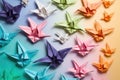 colorful origami crane collection on pastel background