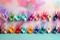 colorful origami crane collection on pastel background