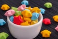 Colorful origami lucky stars in a white bowl Royalty Free Stock Photo