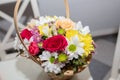 Colorful ornamental variety of flowers in the gift wood basket with roses , leaf and chrysanthemum, daisies,selective