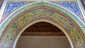 Colorful ornate arabesque plaster carvings above an archway in M Royalty Free Stock Photo