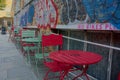 Urban street cafe, colorful Chairs & brick wall graffiti