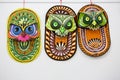 Colorful owl mask hanging on Art institute wall.