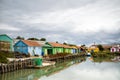 Colorful oyster sheds with flat bottomed oyster boats on the Oleron island, France, under a stormy summer sky Royalty Free Stock Photo