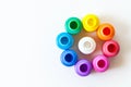 Colorful paint bottles on white paper background with copy space, top view/arts and crafts background concept Royalty Free Stock Photo