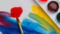 Colorful paintbrush on table, Close-up palette of vibrant watercolor paints and brushes on a table Royalty Free Stock Photo