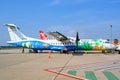 Colorful painted aircrafts with underwater world and beach with palms of Bangkok Air on Airport Siem Reap, Cambodia