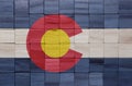 colorful painted big national flag of colorado state on a wooden cubes texture Royalty Free Stock Photo