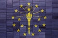 colorful painted big national flag of indiana state on a wooden cubes texture