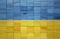 colorful painted big national flag of ukraine on a wooden cubes texture Royalty Free Stock Photo