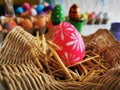 The colorful painted Easter eggs in the basket in the studio false allegation