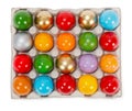 Colorful painted Easter eggs in cardboard storage rack