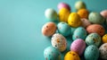 Colorful painted Easter Eggs with various patterns on blue teal Background. Banner with copy space. Ideal for Easter Royalty Free Stock Photo