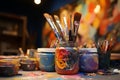 Colorful paints and an assortment of brushes in the artists studio