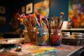 Colorful paints and an assortment of brushes in the artists studio