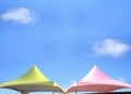 a colorful pair of tent tops on a lazy summer day Royalty Free Stock Photo