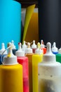 Colorful palette of acrylic paint tubes at artist studio. Choosing different color of paint for his artwork. Creativity and Royalty Free Stock Photo