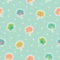 Colorful palm leaves and hearts scattered on pastel blue background seamless vector pattern