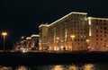 Colorful panorama of the night city with neon lights. Main building of the Ministry of Defense of Russia