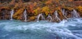 A colorful panorama view of Hraunfossar waterfalls in autumn Royalty Free Stock Photo
