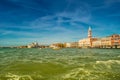 Colorful panoramic view of Doge Palace, Campanile and San Marco square from busy Grand Canal water during sunset, Venice, Italy, Royalty Free Stock Photo