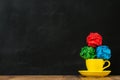 Colorful paper ball heap on the yellow coffee cup Royalty Free Stock Photo