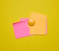 Colorful paper blank stickers attached with a button, space for notes and labels Royalty Free Stock Photo