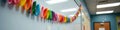 Colorful paper chain decorating classroom wall in bright school setting Royalty Free Stock Photo