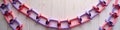 Colorful paper chain garland on light wooden background Royalty Free Stock Photo