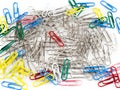 Colorful paper clip and ordinary clips on white background.