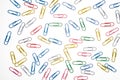 Colorful paper clips on white background - bird's eye view