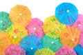 Colorful paper cocktail umbrellas close-up on a white Royalty Free Stock Photo