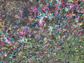 Colorful Paper Confetti In Dirt and Grass Royalty Free Stock Photo