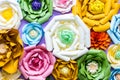 Colorful paper flowers on wall. Handmade artificial floral decoration. Spring abstract beautiful background and texture Royalty Free Stock Photo