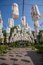 Colorful paper lanterns decorated in open travel place Ho Van in Hanoi, Vietnam with blue sky background