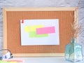 Colorful paper note pinned on a corkboard Royalty Free Stock Photo