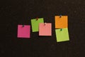 Colorful paper notes pinned to cork board Royalty Free Stock Photo